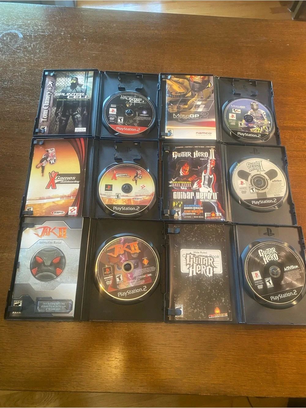 6 PS2 Jak II, Guitar Hero I & II, Splinter Cell, MotoGP 2, X Games Skateboarding
